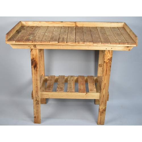 183 - A Pine Planting Stand with Stretcher Shelf, Galleried Top, 107cm wide