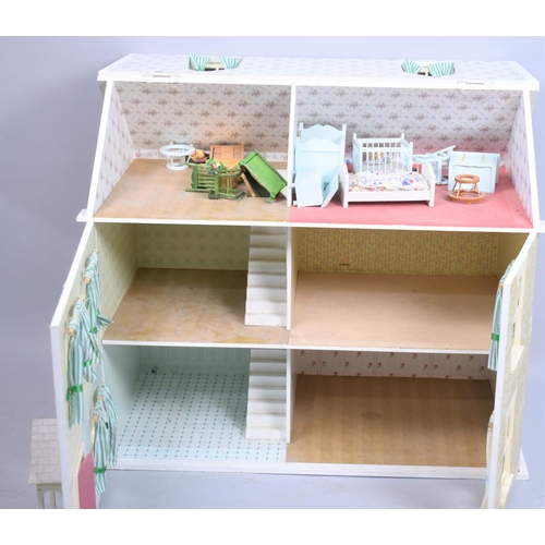 246 - A Modern Dolls House, 70cm Long and 59cm high