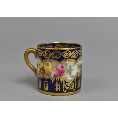 273 - A Miniature Crown Staffordshire Cup decorated with Hand Painted Floral Design on Cobalt Blue and Gil... 