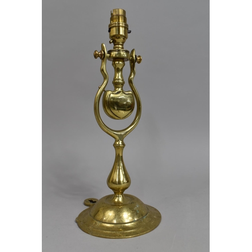 44 - A Free Standing/Wall Hanging Brass Gimballed Light Fitting on Circular Stepped Base, 34cms High