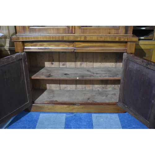 519 - A Late Victorian Mahogany Library Bookcase with Two Centre Drawers Over Cupboard Base, Raised Glazed... 