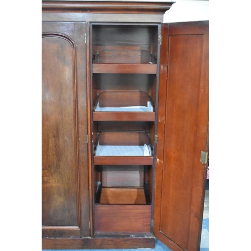 529 - A Late Victorian/Edwardian Mahogany Triple Wardrobe, the Side Section with Three Slides, Plinth Base... 