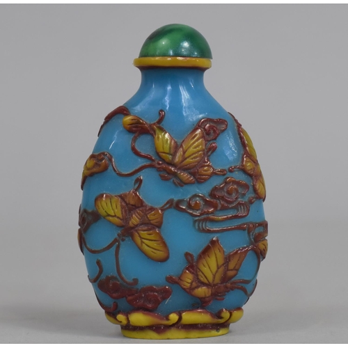 63 - A Chinese Snuff Bottle decorated with Butterflies on Blue Ground, 6.5cms High