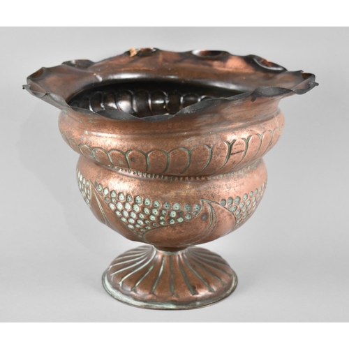 72 - An Edwardian Hammered Copper jardinière with relief Decoration, 26cms Diameter and 19cms High