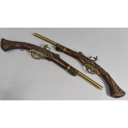 78 - A Pair of Ornamental Reproduction Wall Hanging Flintlock Pistols with Brass Barrels, 52cms Long