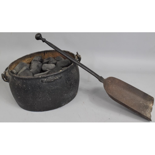 350 - A Vintage Cast Iron Cooking Pot Containing Anthracite Together with a Cast Iron Fire Shovel