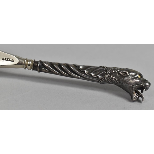 14 - A Silver Plated Shoe Horn with Lioness Head Handle