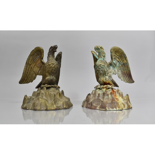 18 - A Pair of Empire Style Verdigris Bronze Eagles Perched with Wings Aback on Naturalistic Rock Bases w... 