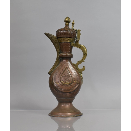 22 - An Islamic Bukhara Copper and Brass Ewer, The Body of Vase Form, Supported on Circular Foot, Engrave... 