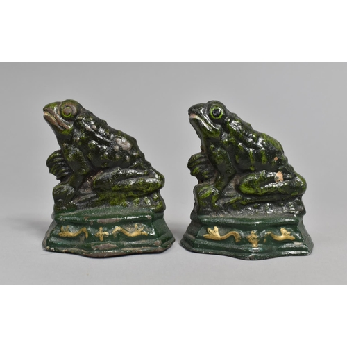 32 - A Pair of Modern Cast Metal Doorstops in the Form of Seated Frogs, 9cms High