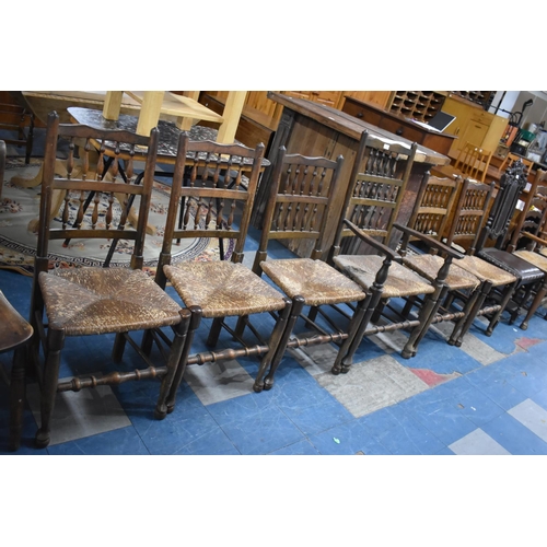 516 - A Set of Six Spindle Back Rush Seated Dining Chairs to Include One Carver