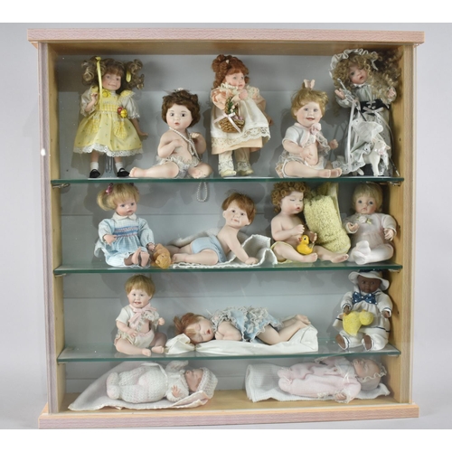 226 - A Glazed Three Shelf Display Cabinet Containing Fourteen Ashton Drake Dolls, 55cm Square