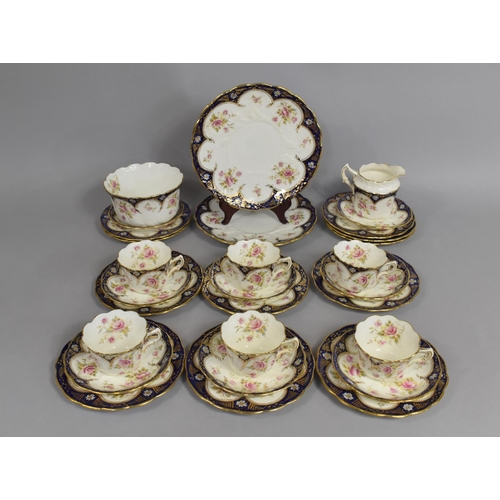 297 - An Edwardian Tea Set decorated with Rose Motif, with Cobalt Blue and Gilt Enriched Trim to comprise ... 