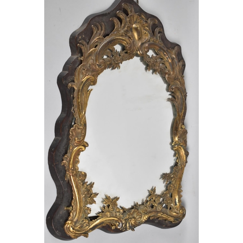 117 - An Art Nouveau Brass Mounted Wall Hanging Wall Mirror, 42x27cms Overall