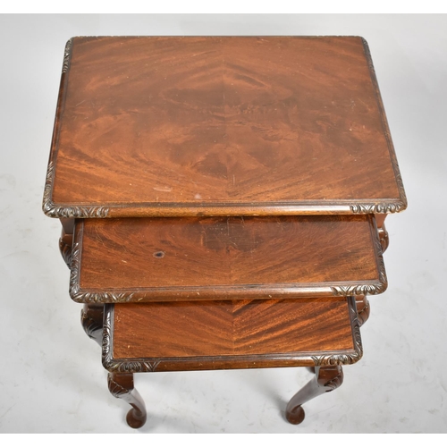 49 - A Late 20th Century Mahogany Nest of Three Tables, 61cms Wide