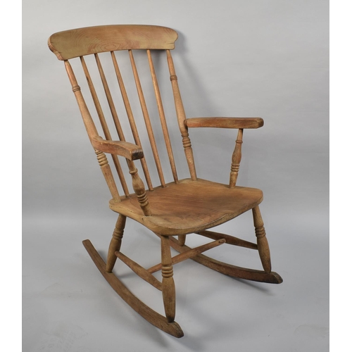 609 - An Elm Seated Spindle Back Rocking Chair