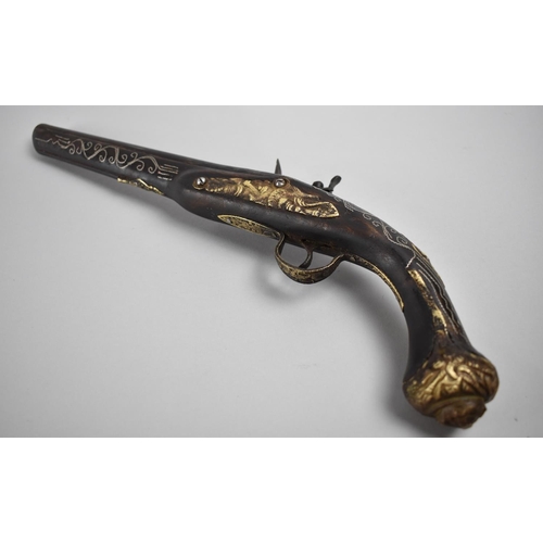 113 - An Indo Persian Flintlock Pistol with Silver Wire Inlay and Brass Fittings