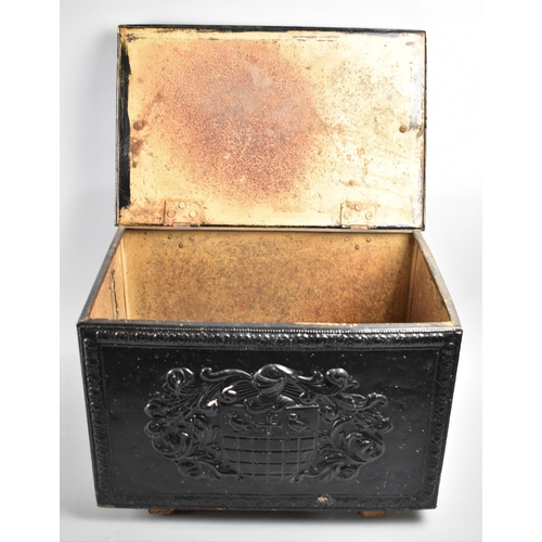 161 - A Black Painted Lift Top Slipper Box with Armorial Decoration in Relief, 46cms Wide