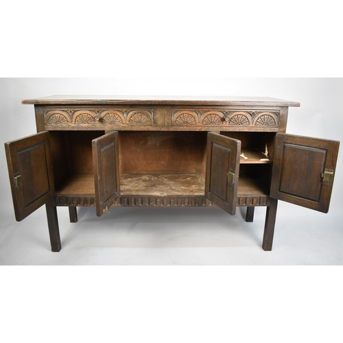 605 - A Late 20th Century Oak Two Drawer Sideboard with Cupboard Base, 137cms Wide