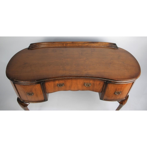 125 - A Mid 20th Century Walnut Serpentine Fronted Writing Desk or Dressing Table with Long Centre Drawer ... 