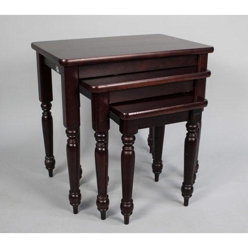 144 - A Nest of Three Mahogany Tables, 56cm wide