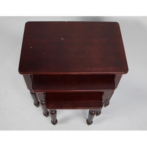 144 - A Nest of Three Mahogany Tables, 56cm wide