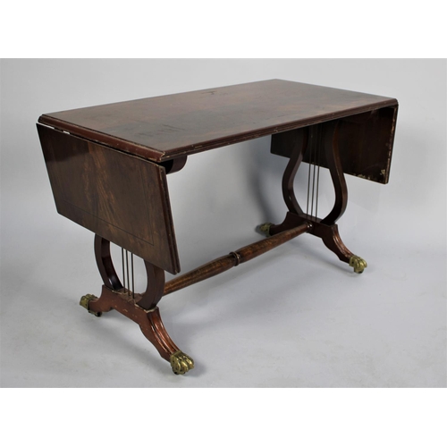 155 - A Mid 20th Century Drop Leaf Coffee Table with Brass Claw Casters, 76cm wide