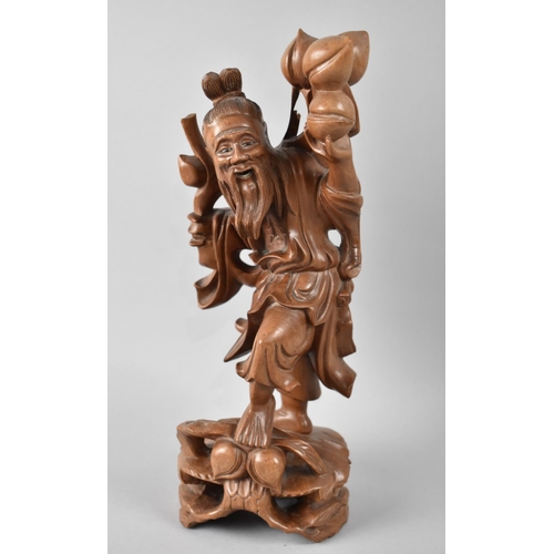 67 - A Mid 20th Century Carved Wooden Rootwood Study of an Elder with Peaches, 31cms High