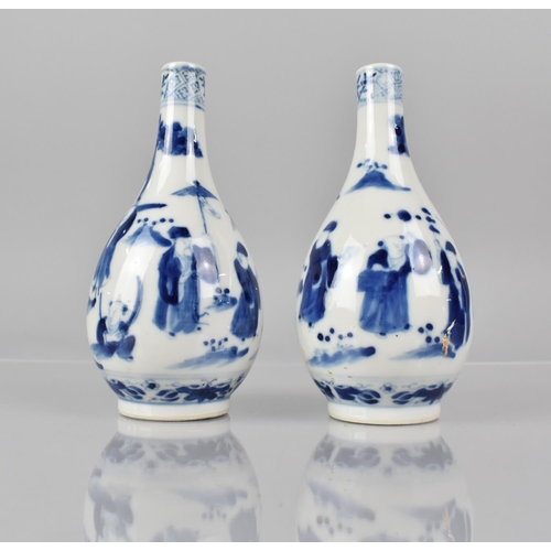 365 - A Pair of 19th Century Chinese Blue and White Bottle Vases decorated with Dignitaries and Figures in... 