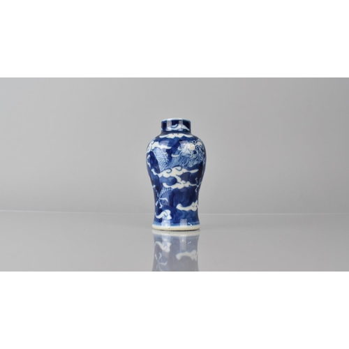 361 - A Small Chinese Blue and White Porcelain Vase of Baluster Form decorated with Dragon Chasing Flaming... 