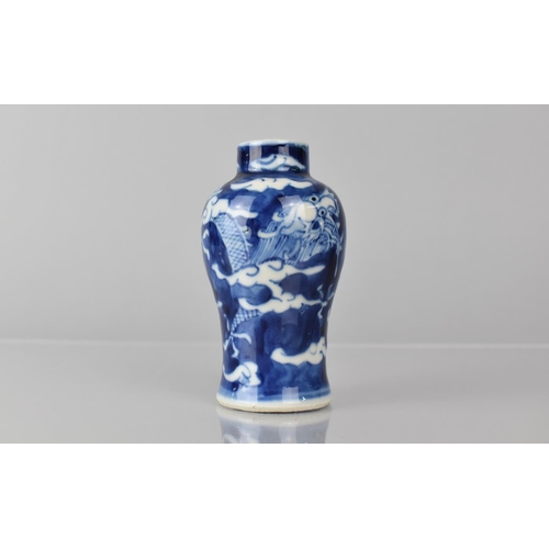 361 - A Small Chinese Blue and White Porcelain Vase of Baluster Form decorated with Dragon Chasing Flaming... 