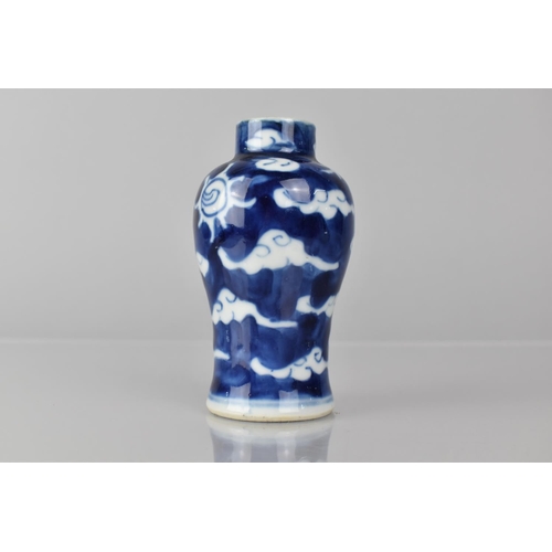 361 - A Small Chinese Blue and White Porcelain Vase of Baluster Form decorated with Dragon Chasing Flaming... 