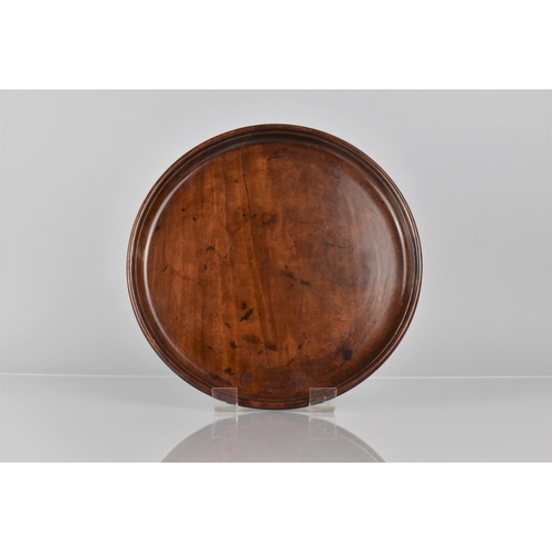 66 - A Late 18th/Early 19th Century Mahogany Circular Tray with Dished Edge, 25cms Diameter