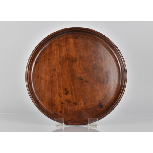 66 - A Late 18th/Early 19th Century Mahogany Circular Tray with Dished Edge, 25cms Diameter