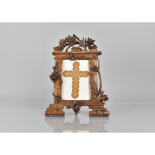 64 - A Late 19th Century Black Forest Easel Back Picture Frame of Architectural Form having Pierced and C... 