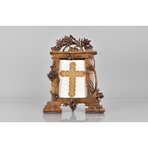 64 - A Late 19th Century Black Forest Easel Back Picture Frame of Architectural Form having Pierced and C... 