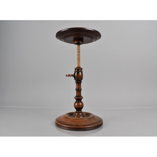 14 - A Georgian Mahogany Candle Stand with Lipped Circular Top Raised on Turned Column and Circular Foot,... 