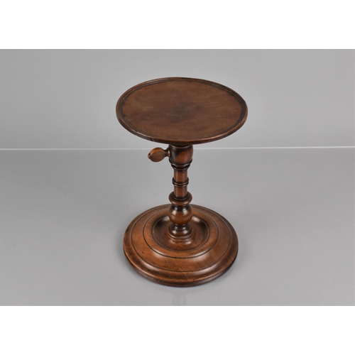 14 - A Georgian Mahogany Candle Stand with Lipped Circular Top Raised on Turned Column and Circular Foot,... 