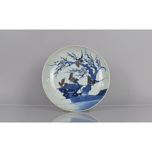 350 - A 19th Century Chinese Blue and White Porcelain Charger decorated with Swallows Perched on Blossomin... 