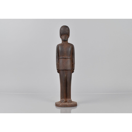 139 - A Mid/Late 20th Century Cast Iron Doorstop in the Form of British Guard, 31cms High