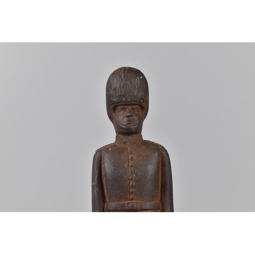 139 - A Mid/Late 20th Century Cast Iron Doorstop in the Form of British Guard, 31cms High