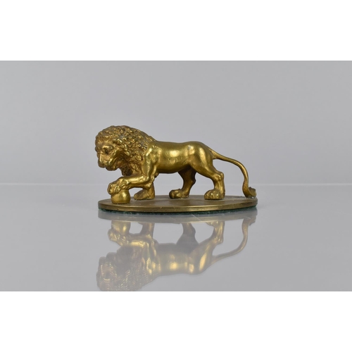 93 - A Gilt Bronze Study of a Medici Lion, Mounted on Oval Base, 11cms Wide and 5cms High