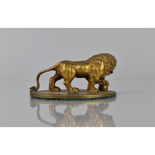 93 - A Gilt Bronze Study of a Medici Lion, Mounted on Oval Base, 11cms Wide and 5cms High