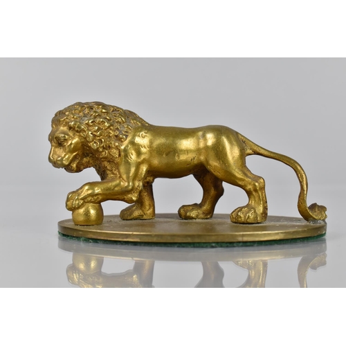 93 - A Gilt Bronze Study of a Medici Lion, Mounted on Oval Base, 11cms Wide and 5cms High