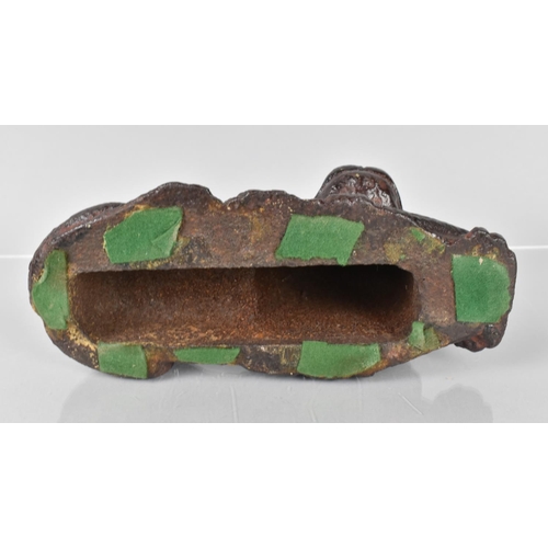 79 - An 18th/19th Century Cast Iron Doorstop in the Form of a Recumbent Lion Having Remnants of Painted D... 