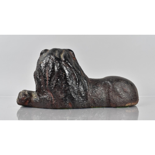 79 - An 18th/19th Century Cast Iron Doorstop in the Form of a Recumbent Lion Having Remnants of Painted D... 