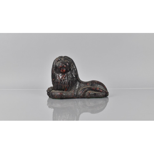 78 - A 19th Century Cast Iron Doorstop in the Form of a Recumbent Lion having Remnants of Red Paint Decor... 