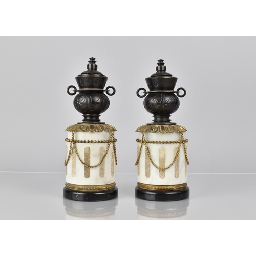 101 - A Pair of French Bronze and Marble Garnitures of Cylindrical Form with Two Handled Vase having Rever... 