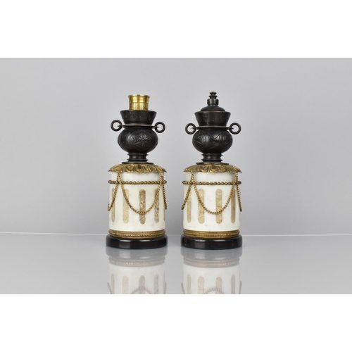 101 - A Pair of French Bronze and Marble Garnitures of Cylindrical Form with Two Handled Vase having Rever... 