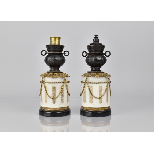 101 - A Pair of French Bronze and Marble Garnitures of Cylindrical Form with Two Handled Vase having Rever... 